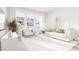 Inviting living room filled with natural light, showcasing modern furnishings, neutral tones, and an airy ambiance at 913 Myers Point Dr, Morrisville, NC 27560