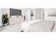 Relaxing main bedroom suite with natural light, calming color palette, and stylish, modern furnishings at 913 Myers Point Dr, Morrisville, NC 27560