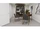Modern home office with large bookcase, desk, and two chairs at 913 Myers Point Dr, Morrisville, NC 27560