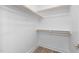 This walk-in closet features built-in shelving and wood flooring at 913 Myers Point Dr, Morrisville, NC 27560