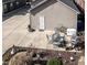 Aerial view of a backyard with a patio featuring outdoor furniture, landscaping, and a well-maintained lawn at 103 Bella Sq Sq, Smithfield, NC 27577