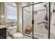 Bathroom featuring a glass shower with a tiled surround and a built-in seat at 103 Bella Sq Sq, Smithfield, NC 27577