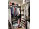 Well-organized walk-in closet with shelving and hanging clothes at 103 Bella Sq Sq, Smithfield, NC 27577