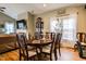Elegant dining room featuring a large table, hardwood floors, and stylish decor at 103 Bella Sq Sq, Smithfield, NC 27577