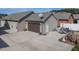 Back exterior view showcases the garage, patio area, and a well-maintained lawn at 103 Bella Sq Sq, Smithfield, NC 27577