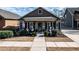 Charming home featuring a covered front porch, well-maintained landscaping, and an inviting entrance at 103 Bella Sq Sq, Smithfield, NC 27577