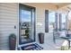 Stylish front entry with a glass door, decorative plants, and comfortable bench seating at 103 Bella Sq Sq, Smithfield, NC 27577