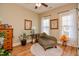 Sitting room featuring hardwood floors, two windows, and a chaise lounge at 103 Bella Sq Sq, Smithfield, NC 27577