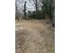 Spacious backyard with mature trees, offering privacy and room for outdoor activities at 104 N Garden Ave, Siler City, NC 27344
