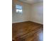 Bedroom featuring natural lighting, hardwood floors, and neutral wall paint at 104 N Garden Ave, Siler City, NC 27344