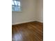 Bedroom featuring natural lighting, hardwood floors, and neutral wall paint at 104 N Garden Ave, Siler City, NC 27344