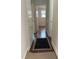 Charming hallway with hardwood floors, traditional built-ins, and view to bedroom at 104 N Garden Ave, Siler City, NC 27344