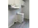 A cozy kitchen corner featuring a light gray vinyl floor, white cabinets, and overhead ventilation at 104 N Garden Ave, Siler City, NC 27344