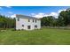 Spacious backyard with a well-maintained lawn and white siding, ideal for entertaining at 124 Ethel Ln, Angier, NC 27501