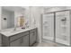 Bathroom featuring double sinks and a glass-enclosed shower for a spa-like experience and daily convenience at 124 Ethel Ln, Angier, NC 27501