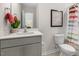 Cozy bathroom with a modern vanity, neutral color scheme, and a shower-tub combo at 124 Ethel Ln, Angier, NC 27501