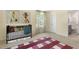 Cozy bedroom featuring comfortable carpet and cheerful decor, with natural light and access to the bathroom at 124 Ethel Ln, Angier, NC 27501