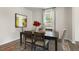 Elegant dining room featuring a wooden table with seating for four and a window view at 124 Ethel Ln, Angier, NC 27501