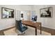 Office space featuring french doors, a wood desk, a patterned rug and modern art at 124 Ethel Ln, Angier, NC 27501
