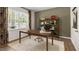 Bright home office with a large window, modern desk, and elegant shelving unit at 124 Ethel Ln, Angier, NC 27501