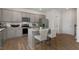 Modern kitchen boasts stainless steel appliances, granite countertops, grey cabinets, and a spacious center island at 124 Ethel Ln, Angier, NC 27501