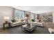 Bright open living space with modern furnishings and view to dining room and kitchen at 124 Ethel Ln, Angier, NC 27501
