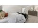 Spacious main bedroom includes neutral walls, plush carpet, dresser and seating for relaxing and resting at 124 Ethel Ln, Angier, NC 27501