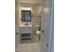 Bright bathroom with a modern vanity, framed mirror, and tile flooring at 130 S Estes Dr # J1, Chapel Hill, NC 27514
