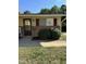 Inviting single-story home featuring brick accents, neat landscaping, and a welcoming front entrance at 130 S Estes Dr # J1, Chapel Hill, NC 27514