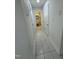 Bright hallway with tile floors leading to a bathroom and additional rooms at 130 S Estes Dr # J1, Chapel Hill, NC 27514