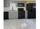 Modern kitchen with gray cabinets, stainless steel appliances, and white subway tile backsplash at 130 S Estes Dr # J1, Chapel Hill, NC 27514