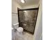 Modern bathroom with tiled shower and glass door at 130 S Estes Dr # J1, Chapel Hill, NC 27514