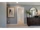 Bedroom featuring textured wallpaper and a glimpse into the bathroom at 132 Kobus Ct, Garner, NC 27529