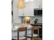 Bright eat-in kitchen with stylish pendant lighting and breakfast bar at 132 Kobus Ct, Garner, NC 27529