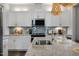 Modern kitchen featuring granite countertops and stainless steel appliances at 132 Kobus Ct, Garner, NC 27529