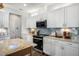 Modern kitchen features white cabinets, stainless steel appliances, and ample counter space at 132 Kobus Ct, Garner, NC 27529
