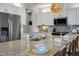Island kitchen with granite countertops, stainless steel appliances and wooden barstool seating at 132 Kobus Ct, Garner, NC 27529