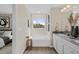 Relaxing bathroom featuring a soaking tub, neutral color palette, and ample natural light for a spa-like experience at 136 Kobus Ct, Garner, NC 27529