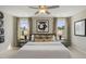 Bright bedroom with a ceiling fan, decorative wall art, and matching side tables at 136 Kobus Ct, Garner, NC 27529