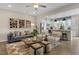 Open concept living room with modern decor flowing into kitchen and dining area at 136 Kobus Ct, Garner, NC 27529