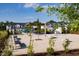 Community playground with covered seating area, benches and manicured landscaping at 140 Kobus Ct, Garner, NC 27529
