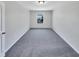 A bright bedroom with a large window offering natural light and views of the surrounding neighborhood at 1424 Elk Falls Dr, Wendell, NC 27591