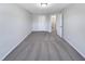 A large bedroom with neutral carpet and paint, a closet and entry into the ensuite bath at 1424 Elk Falls Dr, Wendell, NC 27591