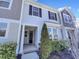 Charming two-story home with manicured landscaping and inviting front porch entrance at 1424 Elk Falls Dr, Wendell, NC 27591