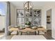 This dining room offers a modern chandelier, a wooden table, and unique wall decorations at 144 Kobus Ct, Garner, NC 27529