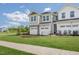 Charming new construction townhome with two-car garage and well-maintained lawn at 144 Kobus Ct, Garner, NC 27529
