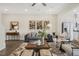 Bright and open living room with large windows and ceiling fan at 144 Kobus Ct, Garner, NC 27529