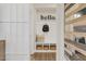Mudroom with a board and batten accent wall, storage baskets, and built-in bench at 144 Kobus Ct, Garner, NC 27529