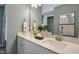 Bathroom showcasing a double vanity with modern fixtures, quartz countertop, and ample storage at 152 Kobus Ct, Garner, NC 27529