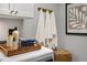 Well-organized laundry room with white cabinets, hanging towels, and decorative basket at 152 Kobus Ct, Garner, NC 27529